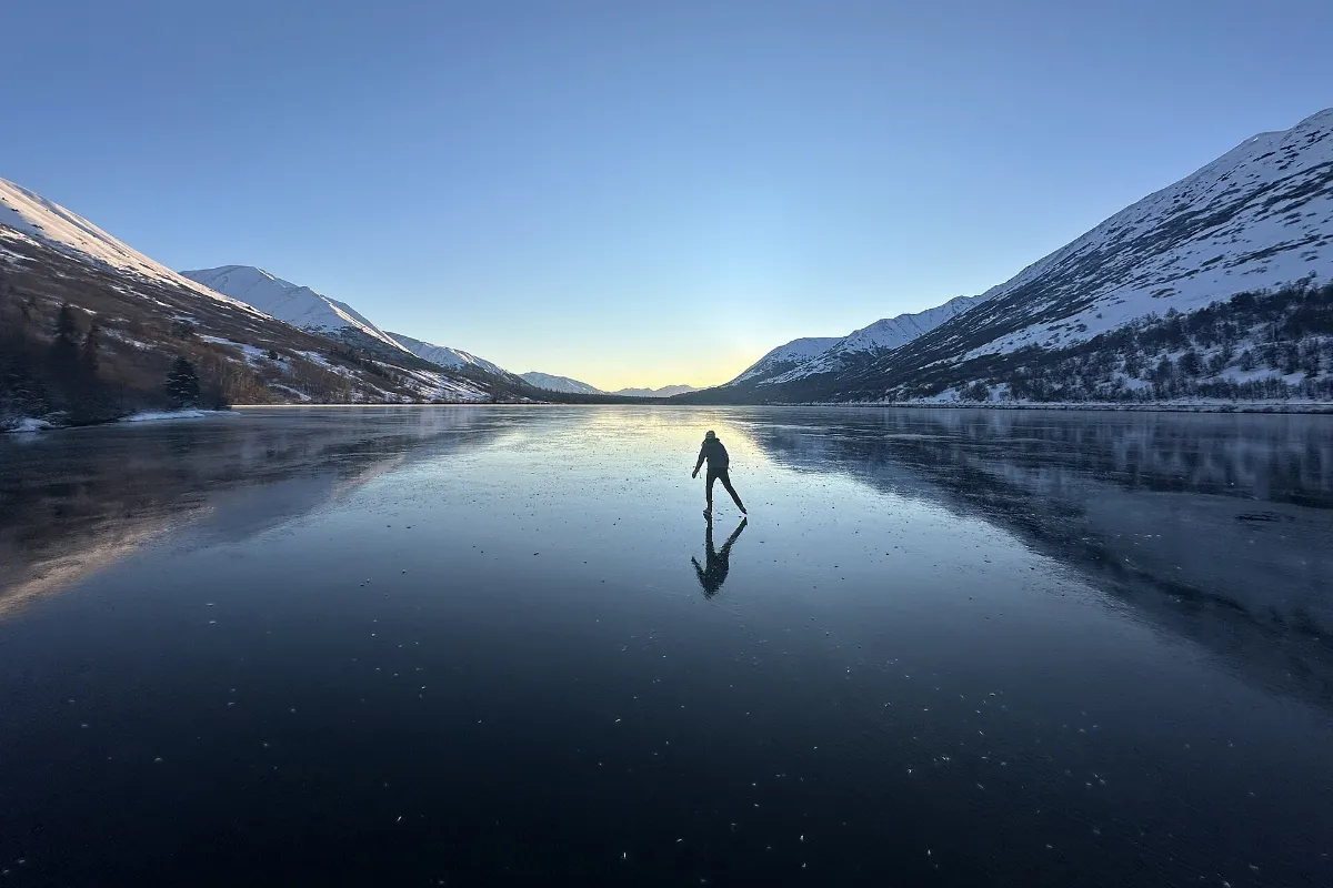 Nordic skating on Summit Lake. Kenai Mountains, Alaska