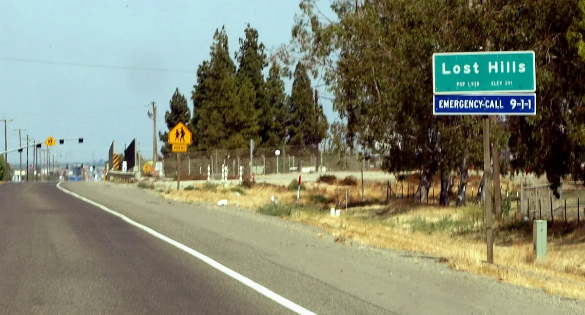 Lost Hills, California western town limits sign (crop) (2011)