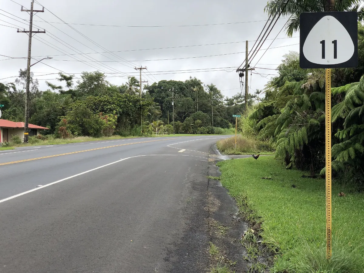 2021-10-09 12 04 51 View southwest along Hawaii State Route 11 (Volcano Road) at Hale Kula Road and Hawelu Road in Kurtistown, Hawaii County, Hawaii
