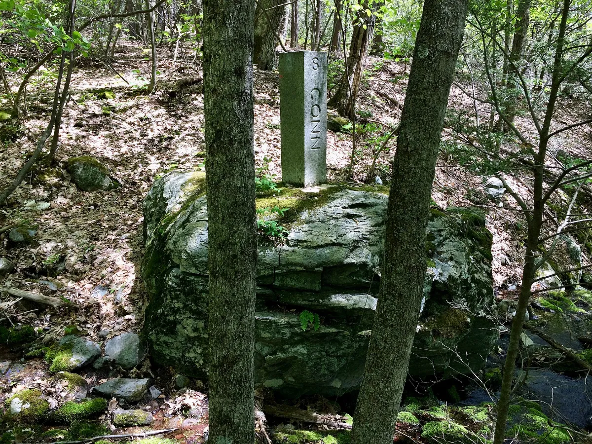 Connecticut-Massachusetts state line boundary marker in Sages Ravine near Connecticut Route 41 and Mount Riga State Park