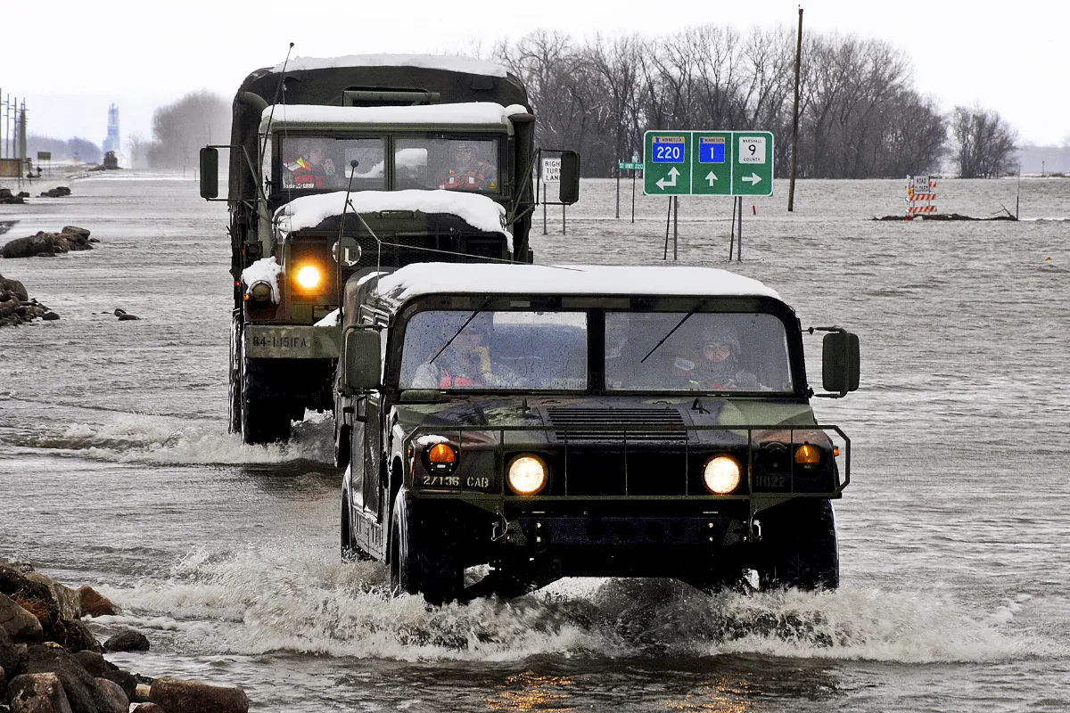 National Guard trucks ford flood in Minnesota